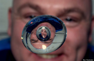 Andre Kuipers, flight engineer, plays with water in space.